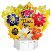 Flower-shaped decorated cookies bouquet with a butterfly and 'Thank You' message in a white box