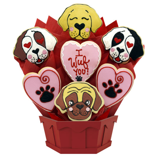 Dog-themed cookie bouquet with heart and paw print decorated cookies in a red container