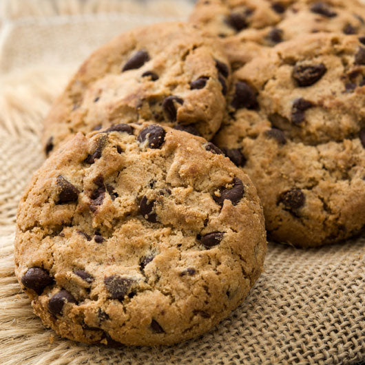 Fresh chocolate chip cookies on rustic burlap, gourmet baked gift delivery