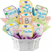 Decorative cookies shaped like baby blocks with personalized text in a white container.